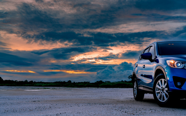 luxury blue suv car parked land usa